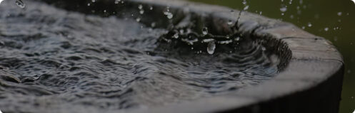 Water splashing in a barrel container