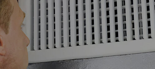 Person inspecting air ducts