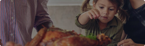 Family enjoying a turkey Thanksgiving dinner