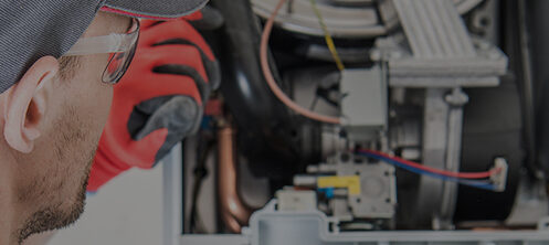 Technician repairing a furnace