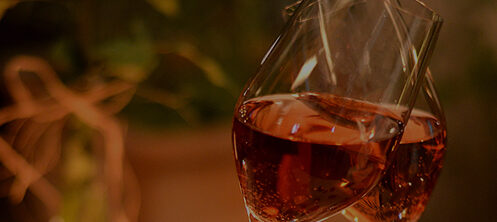 Glasses clinking together in a fancy restaurant