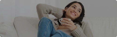 Pretty woman holding a cup of coffee in her Florida home