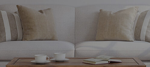 Pretty white couch and a wood coffee table