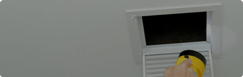 Flashlight shining inside an open air duct